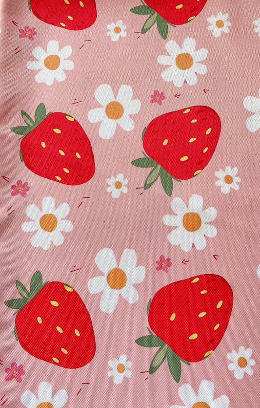 Pattern of strawberries and daisies on a pink background